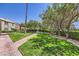 Expansive green lawn with mature trees and manicured landscaping offering a serene outdoor setting at 590 Tam O Shanter, Las Vegas, NV 89109