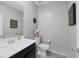 Stylish half bathroom featuring modern fixtures, vanity, and neutral decor at 6247 Milford Sound St, Las Vegas, NV 89148