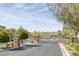 Gated community entrance with stone pillars and lush landscaping, providing security and curb appeal at 6247 Milford Sound St, Las Vegas, NV 89148