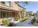 Attractive two-story home boasts stylish shutters and a well-manicured front yard with a seating area at 6247 Milford Sound St, Las Vegas, NV 89148
