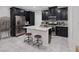 Modern kitchen featuring stainless steel appliances, granite countertops, and a functional island at 6247 Milford Sound St, Las Vegas, NV 89148
