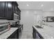 Bright kitchen featuring granite countertops and modern fixtures at 6247 Milford Sound St, Las Vegas, NV 89148