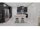 This kitchen boasts a center island with bar stool seating and stainless steel appliances at 6247 Milford Sound St, Las Vegas, NV 89148