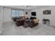 Spacious living room boasts a neutral color scheme, tiled floors, recessed lighting, and a ceiling fan at 6247 Milford Sound St, Las Vegas, NV 89148
