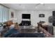 Spacious living room boasts a neutral color scheme, tiled floors, recessed lighting, and a ceiling fan at 6247 Milford Sound St, Las Vegas, NV 89148