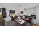 Bright living area flows into the kitchen, creating an open floor plan, with tiled flooring throughout at 6247 Milford Sound St, Las Vegas, NV 89148