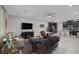 Bright living area flows into the kitchen, creating an open floor plan, with tiled flooring throughout at 6247 Milford Sound St, Las Vegas, NV 89148