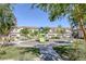 Community playground with slide and lush green grass at 6247 Milford Sound St, Las Vegas, NV 89148