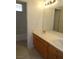 Bathroom featuring double sinks, tiled floors, and a shower/tub combo at 7649 Slide Rock Ave, Las Vegas, NV 89113