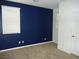 A bedroom with carpeted floors and a window with blinds at 7649 Slide Rock Ave, Las Vegas, NV 89113