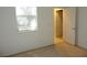 Bedroom featuring a window with natural light and carpeted flooring at 7649 Slide Rock Ave, Las Vegas, NV 89113