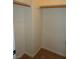 Spacious walk-in closet with wood shelves at 7649 Slide Rock Ave, Las Vegas, NV 89113