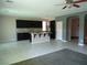Modern kitchen with dark cabinets, granite countertops, and an island with bar seating at 7649 Slide Rock Ave, Las Vegas, NV 89113