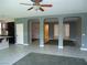 Bright living area featuring tile flooring and arched doorways connecting to other rooms at 7649 Slide Rock Ave, Las Vegas, NV 89113