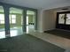 Spacious living area with tile floors, arched doorways, and neutral paint at 7649 Slide Rock Ave, Las Vegas, NV 89113