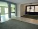 Open-concept living space featuring neutral walls and tiled floors at 7649 Slide Rock Ave, Las Vegas, NV 89113