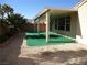 This covered patio features artificial turf surface, beautiful columns and a charming pergola at 7649 Slide Rock Ave, Las Vegas, NV 89113
