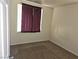 Vacant secondary bedroom featuring neutral walls, carpet and a window at 7971 Duneville St, Las Vegas, NV 89139