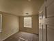 Neutral bedroom featuring a window with blinds and carpet flooring, bathed in natural light at 7971 Duneville St, Las Vegas, NV 89139