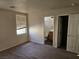 Vacant bedroom showing neutral paint, carpet and a window with blinds at 7971 Duneville St, Las Vegas, NV 89139