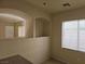 Dining room with a decorative arched niche, a window and tiled floor at 7971 Duneville St, Las Vegas, NV 89139
