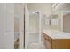 Bathroom vanity with wood cabinets and view to bedroom at 8125 Turbys Treehouse Pl, Las Vegas, NV 89131
