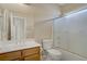 This is a neutral bathroom with a tub and shower combination, as well as a wood vanity with a white sink at 8125 Turbys Treehouse Pl, Las Vegas, NV 89131