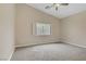 This primary bedroom has neutral walls, carpet floors, a ceiling fan and white plantation shutters at 8125 Turbys Treehouse Pl, Las Vegas, NV 89131