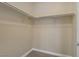 A well-organized closet with metal rods for hanging clothes and carpet flooring at 8125 Turbys Treehouse Pl, Las Vegas, NV 89131