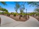 Scenic community park featuring walking paths, mature trees, and a charming shaded picnic area at 8125 Turbys Treehouse Pl, Las Vegas, NV 89131