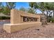 Landscaped community entrance sign reading 'Estates' with stone accents and manicured surroundings at 8125 Turbys Treehouse Pl, Las Vegas, NV 89131