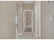 Hallway with tile floors and multiple doorways at 8125 Turbys Treehouse Pl, Las Vegas, NV 89131