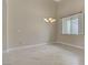 Bright and airy living room with tile flooring, neutral walls, and a large window at 8125 Turbys Treehouse Pl, Las Vegas, NV 89131