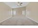 Spacious main bedroom with vaulted ceiling, ceiling fan, carpet, and shuttered windows at 8125 Turbys Treehouse Pl, Las Vegas, NV 89131