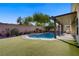 Inviting backyard pool and covered patio area perfect for outdoor entertaining at 8125 Turbys Treehouse Pl, Las Vegas, NV 89131