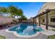 Sparkling pool with a brick-paved deck and covered patio for relaxing poolside at 8125 Turbys Treehouse Pl, Las Vegas, NV 89131