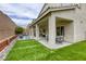 Large backyard featuring artificial turf, and a covered patio at 8137 Crushed Velvet Pl, Las Vegas, NV 89166