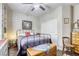 Charming bedroom featuring built-in shelving and a decorative ceiling fan at 8137 Crushed Velvet Pl, Las Vegas, NV 89166