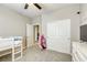 Bedroom with carpet, a ceiling fan, and a closet with sliding doors, offering ample storage space at 8137 Crushed Velvet Pl, Las Vegas, NV 89166