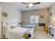 Bedroom featuring two twin beds, neutral walls, carpet, and a ceiling fan at 8137 Crushed Velvet Pl, Las Vegas, NV 89166