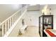 Welcoming foyer with a staircase, shiplap accent wall, and functional storage solutions at 8137 Crushed Velvet Pl, Las Vegas, NV 89166