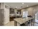 Kitchen with stainless steel appliances, white subway tile, and granite countertops at 8137 Crushed Velvet Pl, Las Vegas, NV 89166
