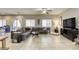 Spacious living room with tile flooring, neutral paint, and views of the backyard at 8137 Crushed Velvet Pl, Las Vegas, NV 89166