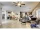 Open floor plan with dining and living areas, connecting seamlessly to the modern kitchen at 8137 Crushed Velvet Pl, Las Vegas, NV 89166