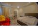 Cozy bedroom with a comfortable bed, study desk, storage cabinet and plenty of natural light at 8310 W Camero Ave, Las Vegas, NV 89113