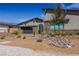 Charming single-story home with modern design, stylish landscaping, and attached two-car garage at 8310 W Camero Ave, Las Vegas, NV 89113