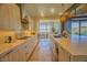 Stylish kitchen with marble countertops, designer cabinetry, and modern stainless steel appliances at 8310 W Camero Ave, Las Vegas, NV 89113