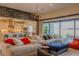 Spacious living room with a large comfortable couch, open floor plan, and plenty of natural light from the sliding glass doors at 8310 W Camero Ave, Las Vegas, NV 89113