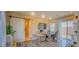 Bright home office with a sliding barn door, modern desk setup, and a sliding glass door to the backyard at 8310 W Camero Ave, Las Vegas, NV 89113