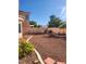 A low maintenance backyard with desert landscaping is ready for outdoor entertaining and relaxation at 8788 Elise Ct, Henderson, NV 89074